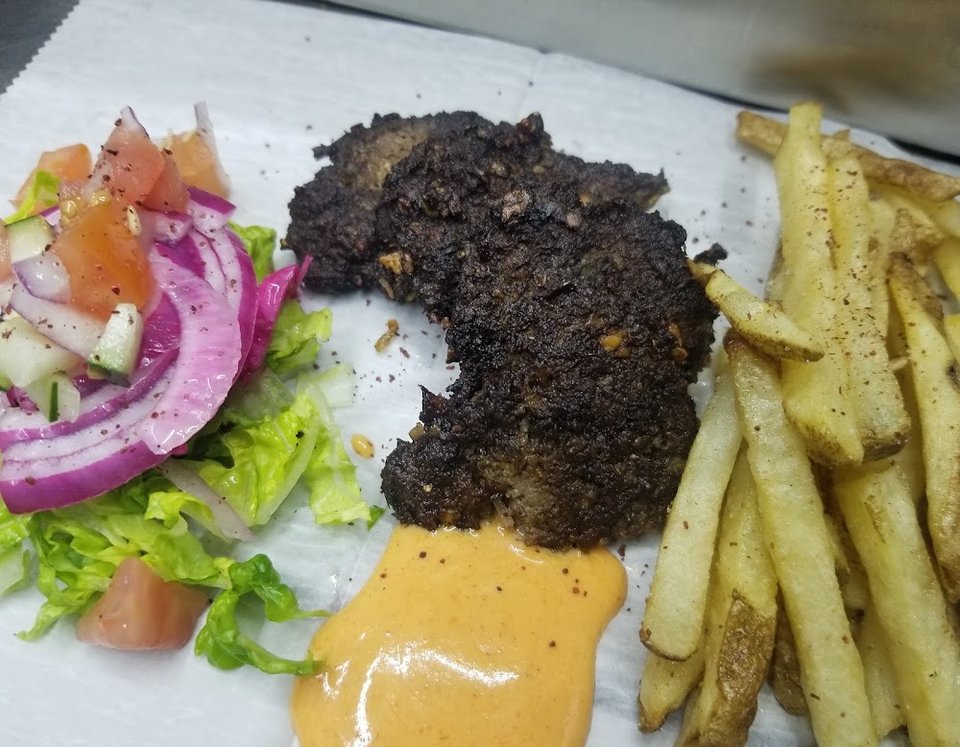 Restaurant menu with wraps, burgers, and sodas